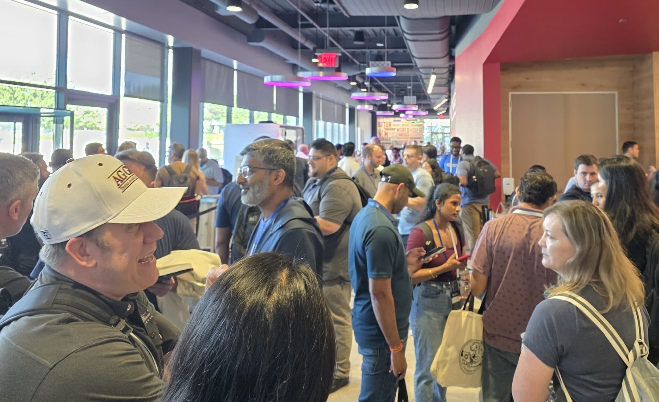 Conference floor buzzing with attendees