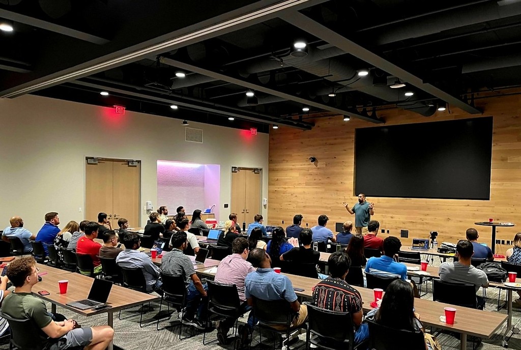 People listening to a conference talk